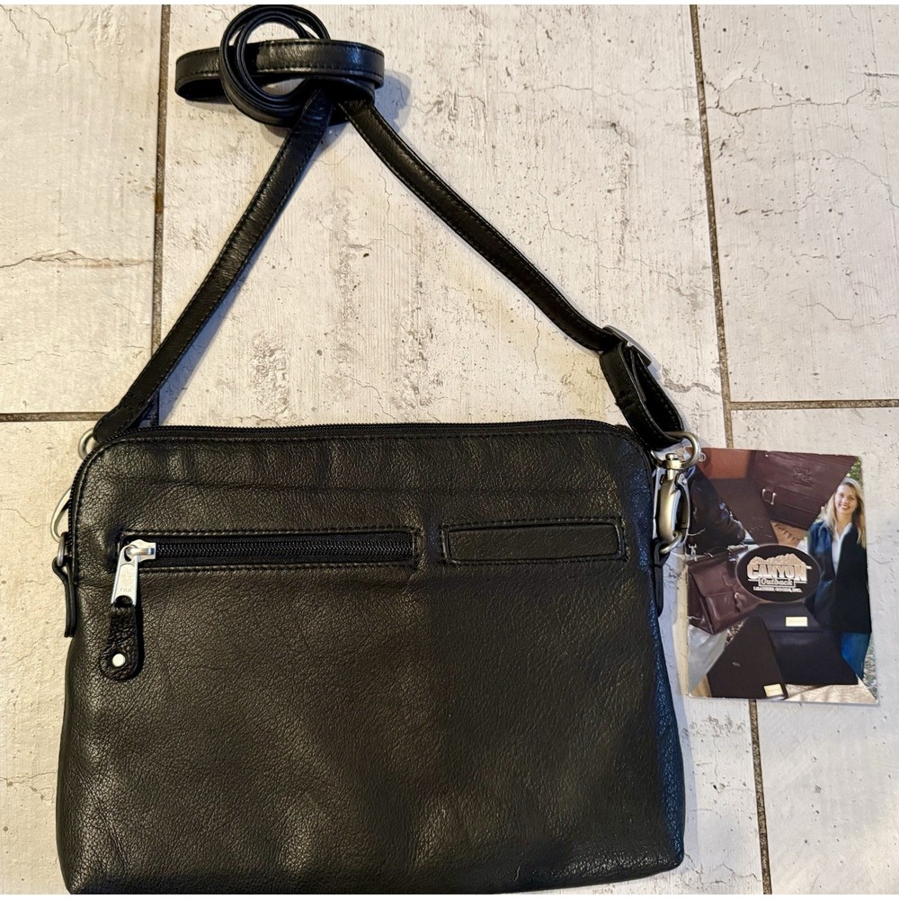 Canyon Outback-Crossbody/Shoulder Handbag Black leather NWT Adjustable Classy